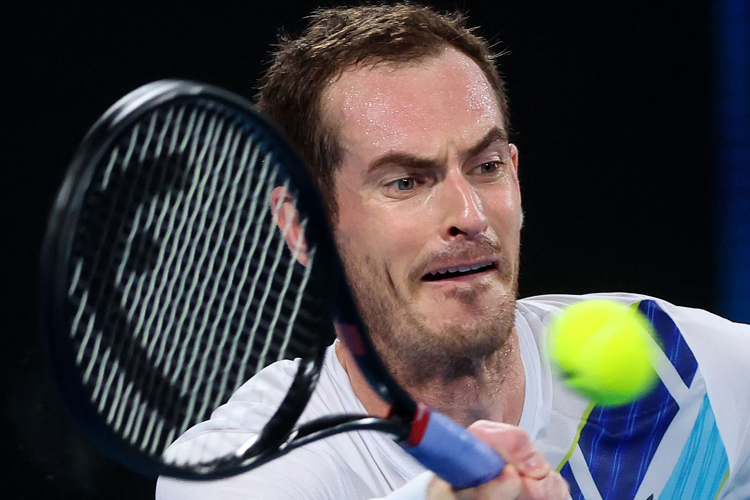 Andy Murray of Britain hits a return against Nikoloz Basilashvili of Georgia during their men's singles match at the Sydney Classic tennis tournament in Sydney on January 12, 2022. (Photo by DAVID GRAY / AFP) / -- IMAGE RESTRICTED TO EDITORIAL USE - STRICTLY NO COMMERCIAL USE -- (Photo by DAVID GRAY/AFP via Getty Images)